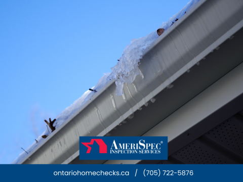Ice buildup and icicles forming along gutter edge.