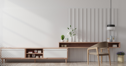 Minimalist home workspace with wooden desk, chair, and modern decor.