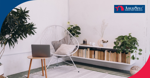 Cozy reading nook with a laptop, bookshelf, and indoor plants.