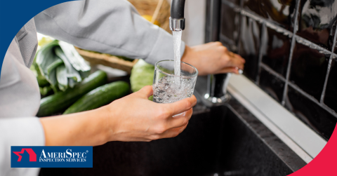 Person filling a glass of water from a kitchen faucet.